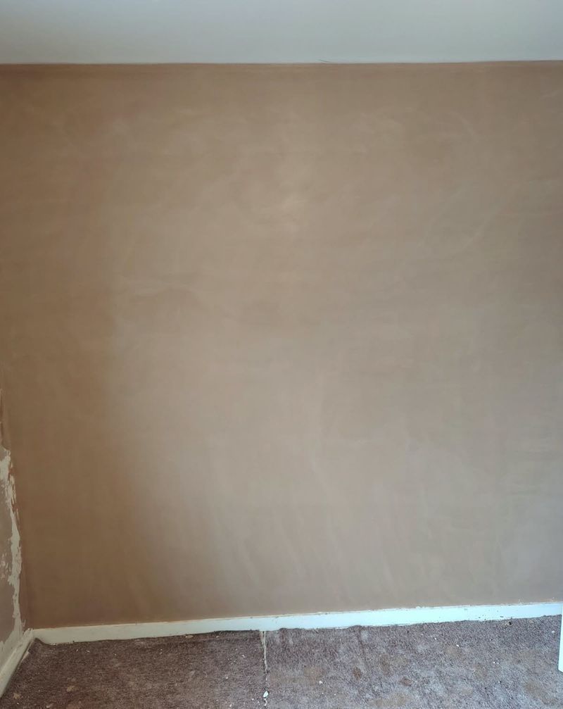 Smooth, freshly plastered wall above a radiator