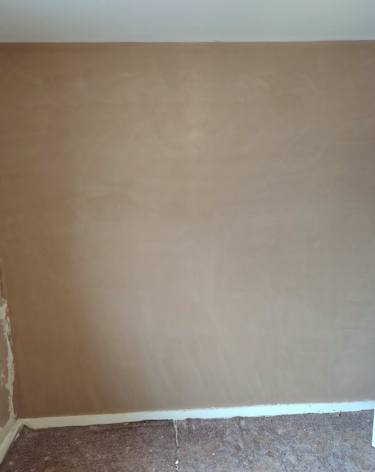 Smooth, freshly plastered wall above a radiator