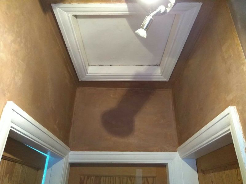 Small landing with freshly plastered walls and a loft hatch above